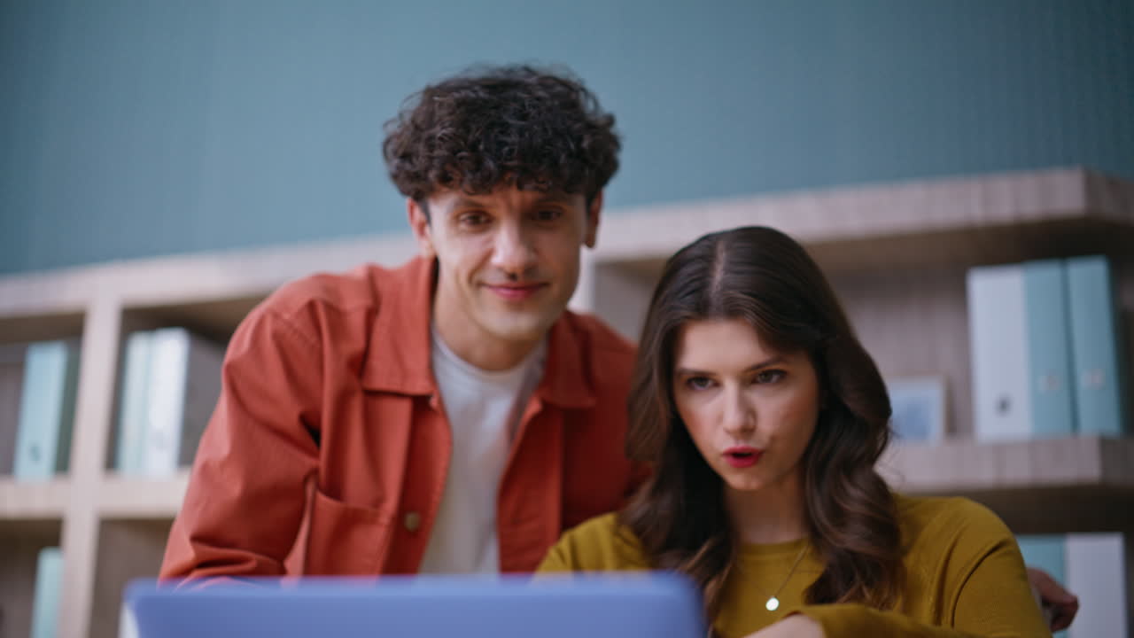 Teammates brainstorming video call in coworking space closeup. Smiling man woman