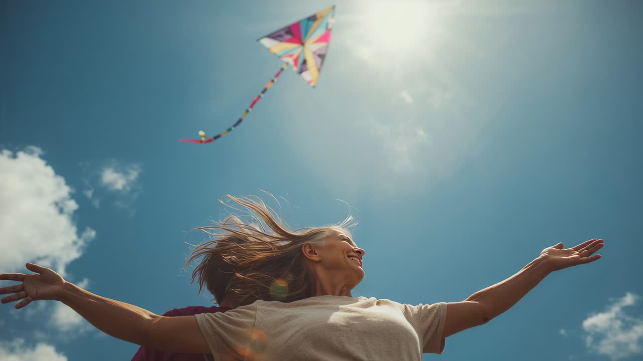 Tightening camera revealing front woman smiling and extending arms at park, celebrating kite flight