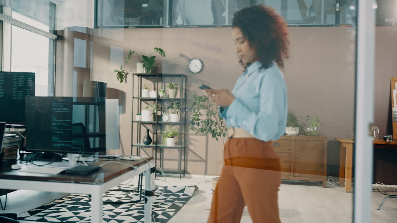 A woman is working at her desk