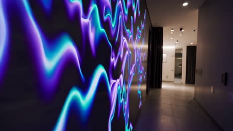 modern hallway with abstract wavy neon light display