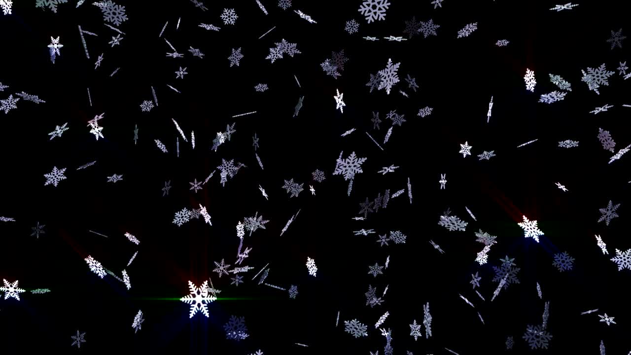 Snøflak faller på svart bakgrunn