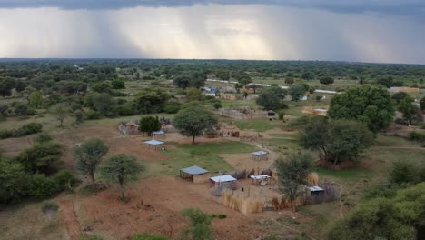 africa rural natural landscapes - flying over traditional huts in village