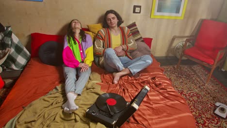 couple relaxing in a retro bedroom
