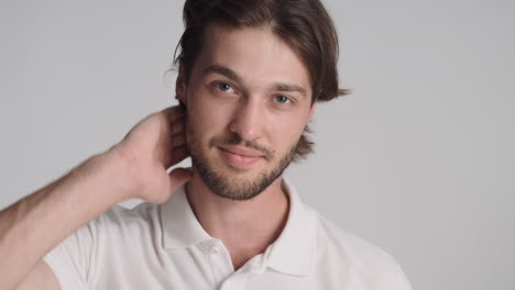 Caucasian-man-in-front-of-camera-on-gray-background.