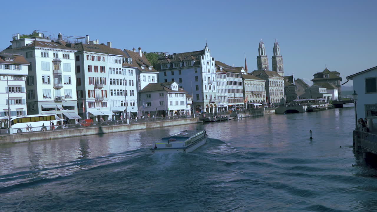 Scenic view of historic Zurich city center with famous Fraumunster and Grossmunster Churches and river Limmat at Lake Zurich, Canton of Zurich, Switzerland