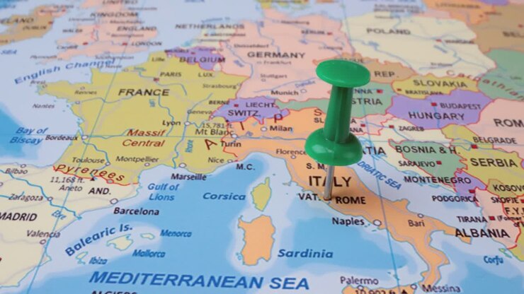 Italy - Travel concept with green pushpin on the world map. The location point on the map points to Rome the capital of the Italy .
