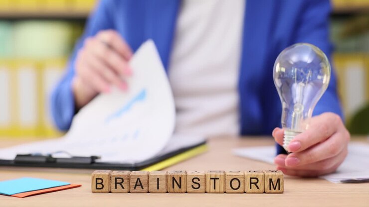 Brainstorming session with lightbulb and charts