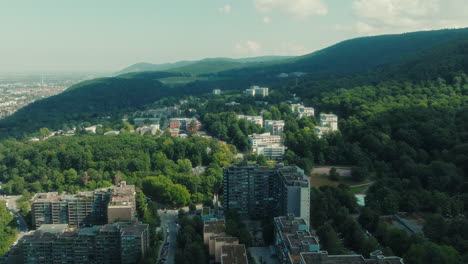 aerial: emmertsgrund cityscape and neighborhood during the day in heidelberg, state of baden-wurttemberg, germany, pan drone shot