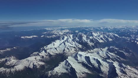 Aerial-high-POV-of-The-Mont-Blanc-mountain-in-The-Alps-range,-shot-from-an-airplane-cockpit-flying-northbound-at-8000m-high,-in-a-splendid-summer-morning