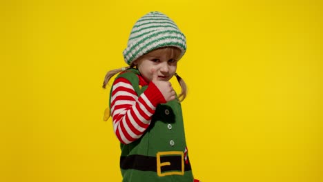 Kid-girl-child-in-Christmas-elf-Santa-helper-costume-showing-thumbs-up-gesture.-New-Year-holiday