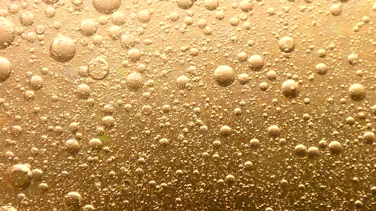 Sfondo di bolle d'oro che turbinano lentamente