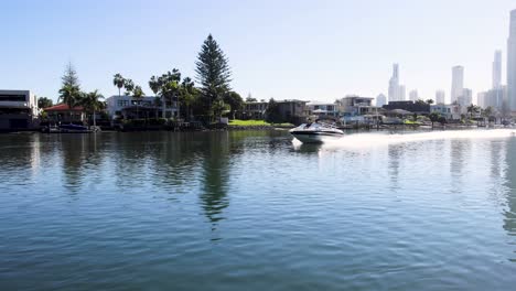 a boat travels along a scenic canal