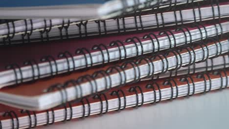 close shot of an assortment of ring bound books rotating