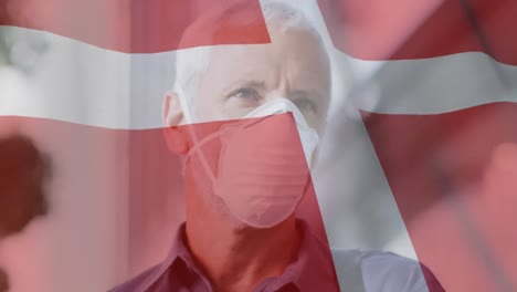 Animation-Der-Flagge-Dänemarks,-Die-über-Einem-Mann-Mit-Gesichtsmasken-Weht