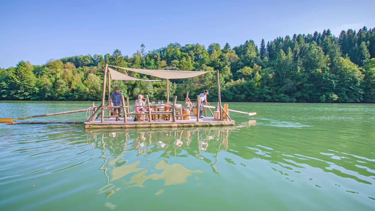 Calm family raft ride. Traditional Drava river experience. Tracking shot