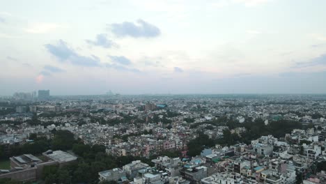 4k aerial shots of new delhi residential suburbs on a beautiful day gliding over rooftops, streets, parks and markets in india