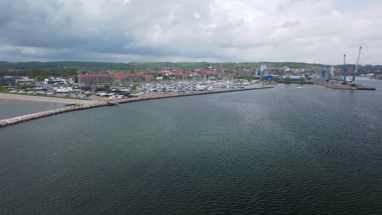 Yacht port of Aabenra Denmark dramatic clouds, circle aerial view