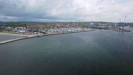Yacht port of Aabenra Denmark dramatic clouds, circle aerial view