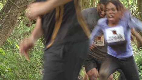 competitors running through a forest at an endurance event