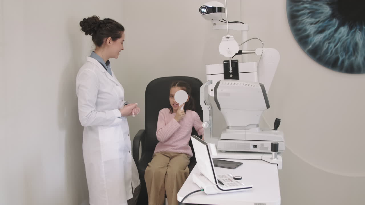 Girl At Optometrist Appointment Doing Eye Checkup