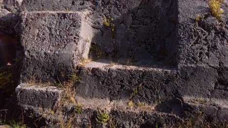 a view of antique building blocks of cusilluchayoc el templo de los monos in cusco district, peru - close up