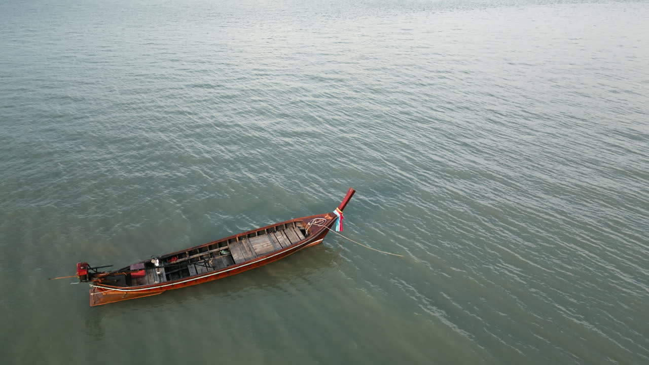 Wooden Longtail Boat on Calm Water