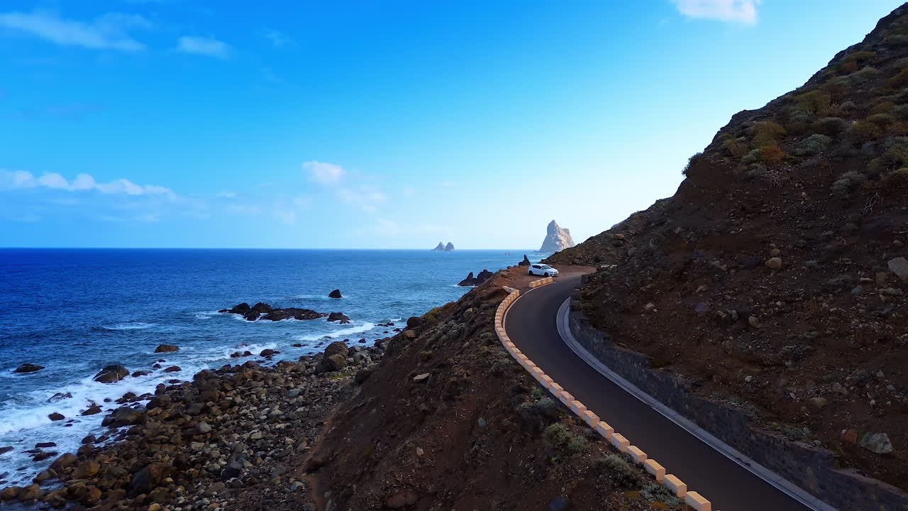 Footage along the highway on the slope of the bare mountain. Rocky coast of Tenerife, the Canary Islands, Spain
