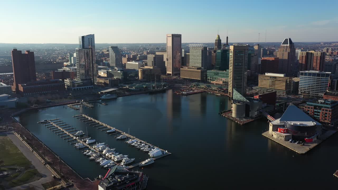 Cinematic Aerial View of Baltimore, Maryland USA, Inner Harbor Marina and Skyscrapers on Waterfront