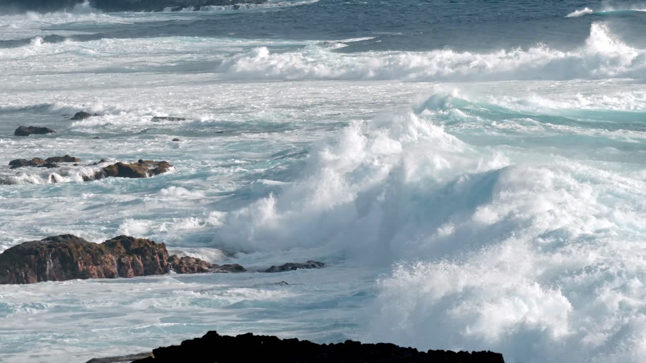 Powerful Atlantic waves crash against the rugged volcanic coastline near Timanfaya National Park in Lanzarote, part of Spain’s Canary Islands.
