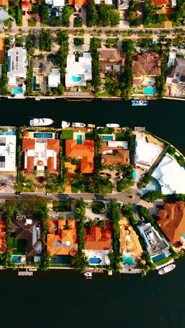 cozy densely-built area with lots of private mansions. aerial view on miami, florida, usa. vertical video