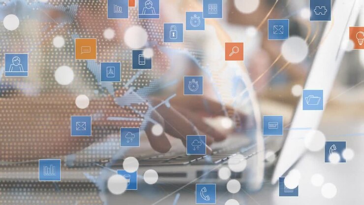 Hands typing on a laptop surrounded by numeric applications