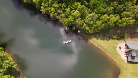 this is a slow shot of a boat coming to shore from a drone