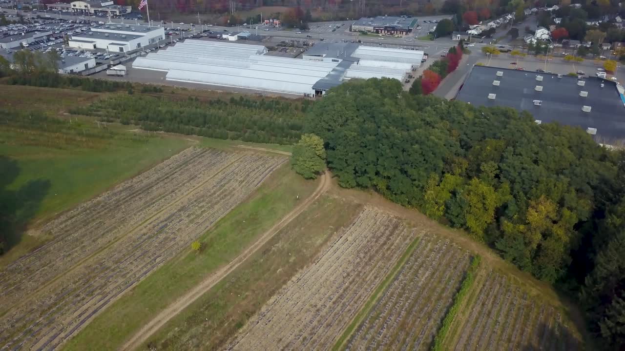 Aerial froward view of industrial area near fields in Peabody. USA