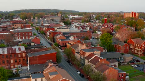 Amazing-magic-hour-light-illuminates-business,-home,-buildings-in-town-in-USA