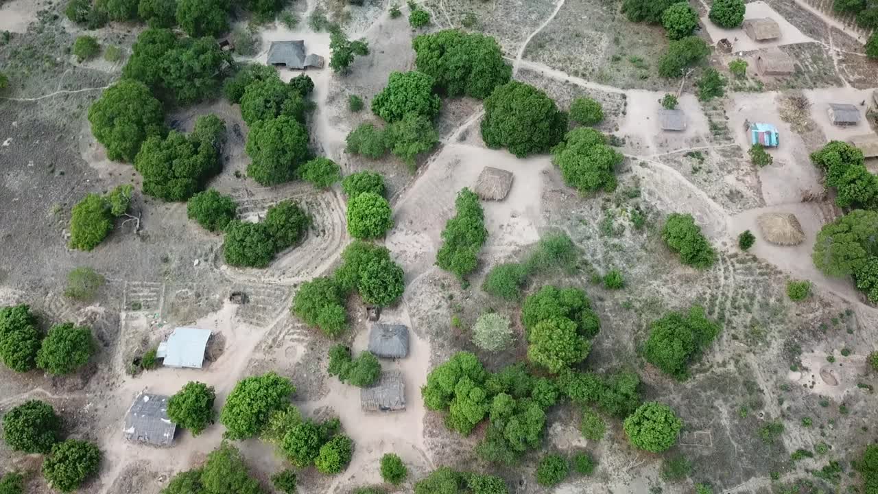 Aerial Drone View of Rural Village in Mozambique with Traditional Huts