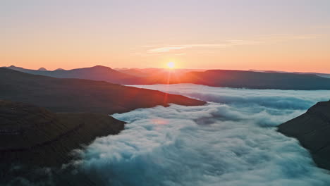 Sunrise over a Cloud-Filled Valley in Mountains