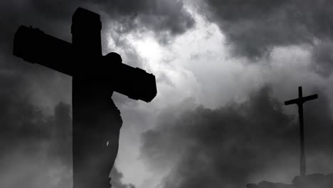 thunderstorm and foreground jesus crucified silhouetted on a hill