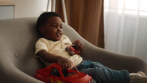 child playing with toy cars