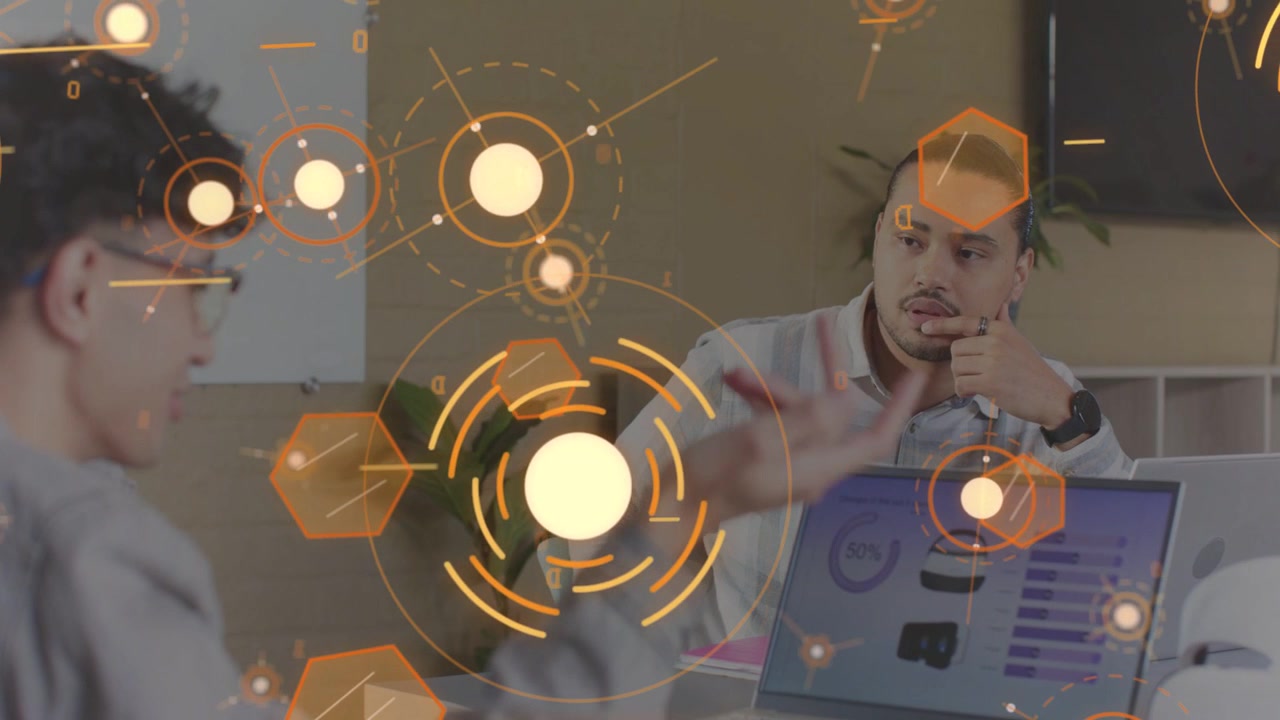 Left man gesturing at laptop, initiating orange AR HUD showing thumbnails, charts for product plan