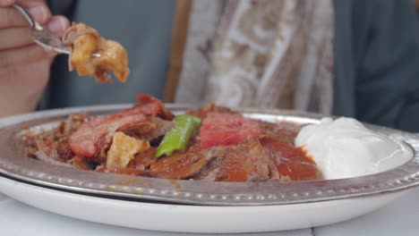 Person Eating Turkish Doner Kebab