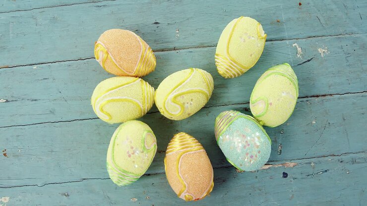 Painted Easter eggs on wooden surface