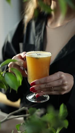 woman holding a warm spiced drink