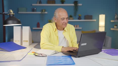 Home office worker old man happy and smiling.