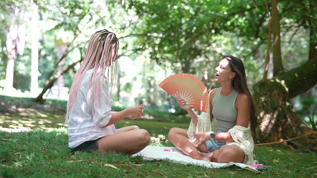 Two women sitting in a park