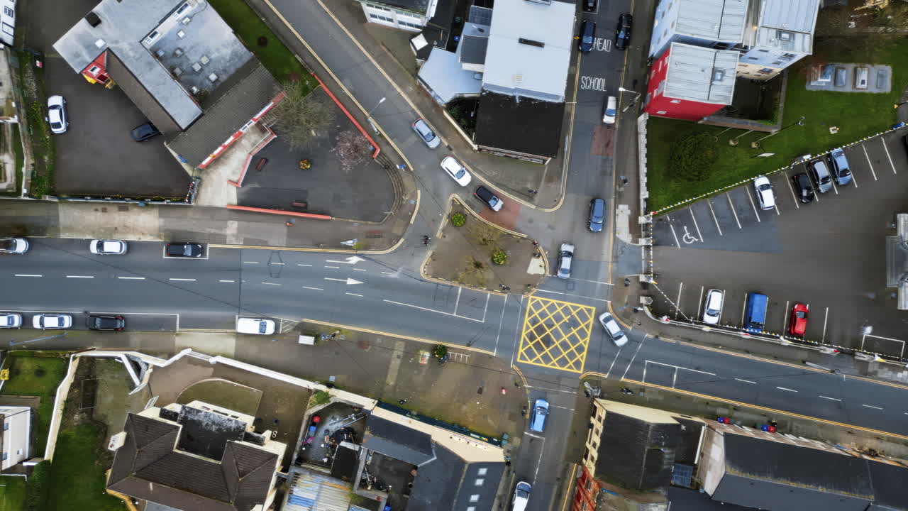 Aerial drone view of cars moving on the streets near the St Anne's Church Shandon Bells and Tower in Cork, Ireland