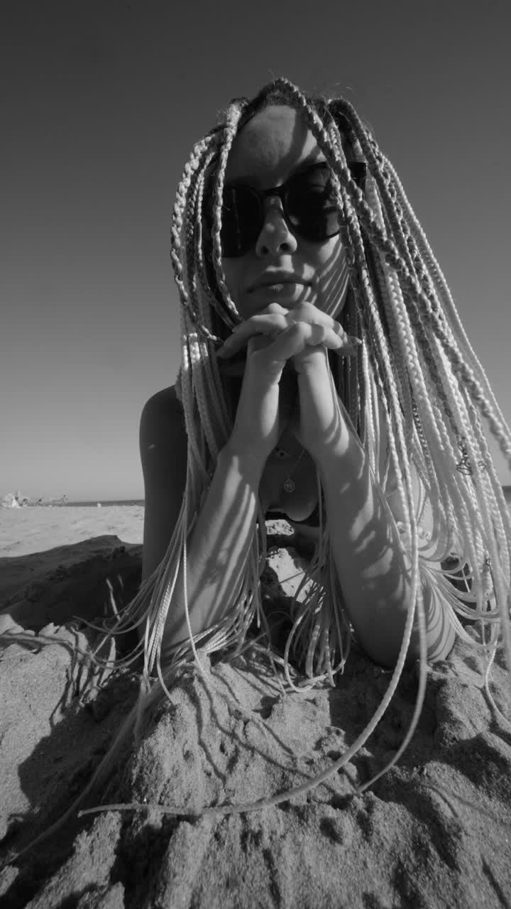 Woman with braids at the beach