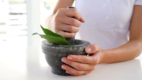 close up of woman therapist preparing a mixture