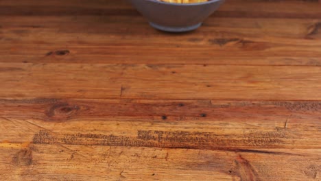 Detailed-close-up-of-grated-cheese-french-fries-being-removed-from-the-table