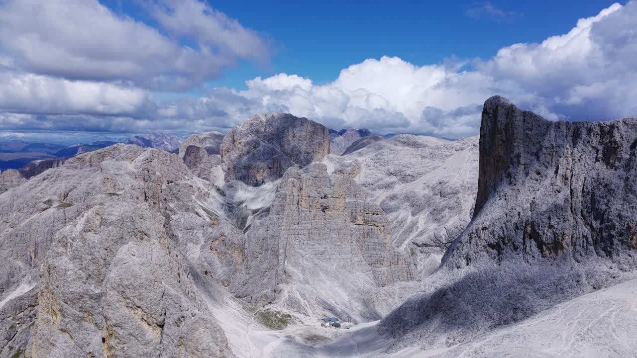 Aerial view discovering the rugged Vajolet Towers and alpine landscape in the Dolomites, Italy