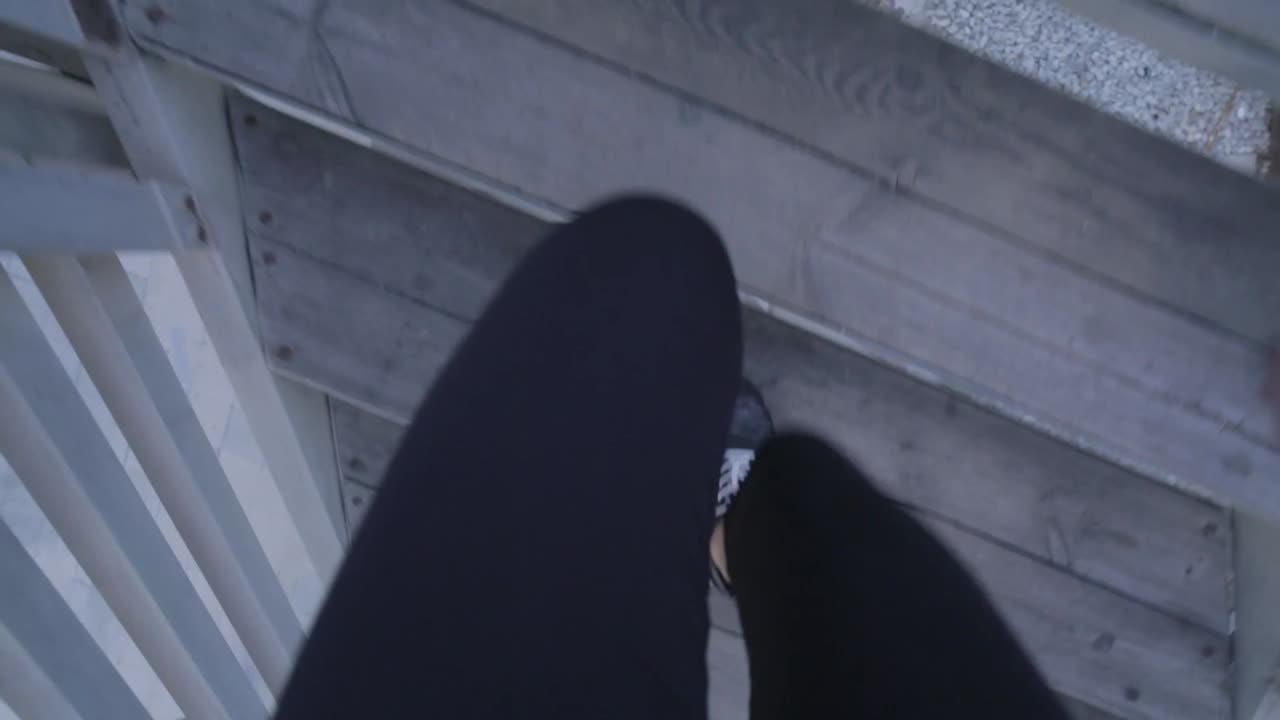 POV of a young woman running in the beach.